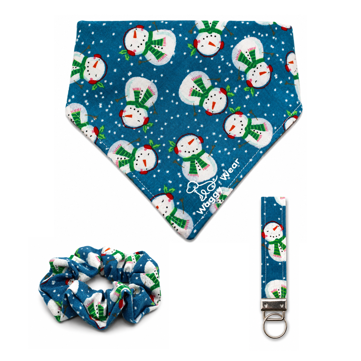Blue snowman-print dog bandana, matching scrunchie, and leash clip from the Waggy Wear Snowman Season Bundle.