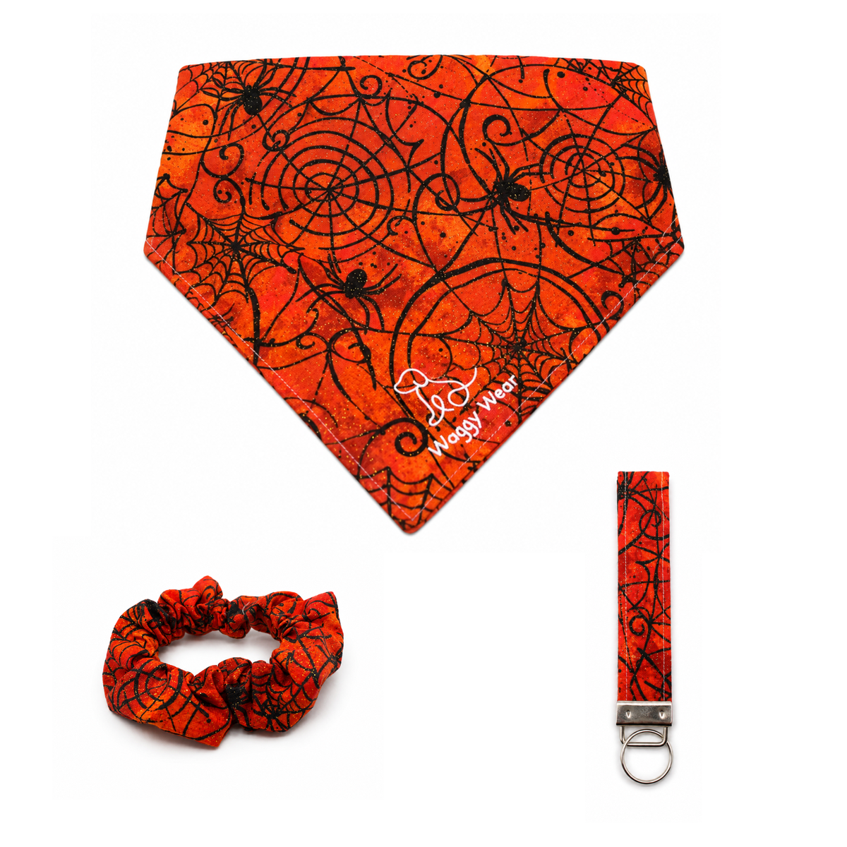 Orange spiderweb dog bandana, scrunchie, and leash clip set featuring black Halloween patterns and the Wag-O-Web logo.