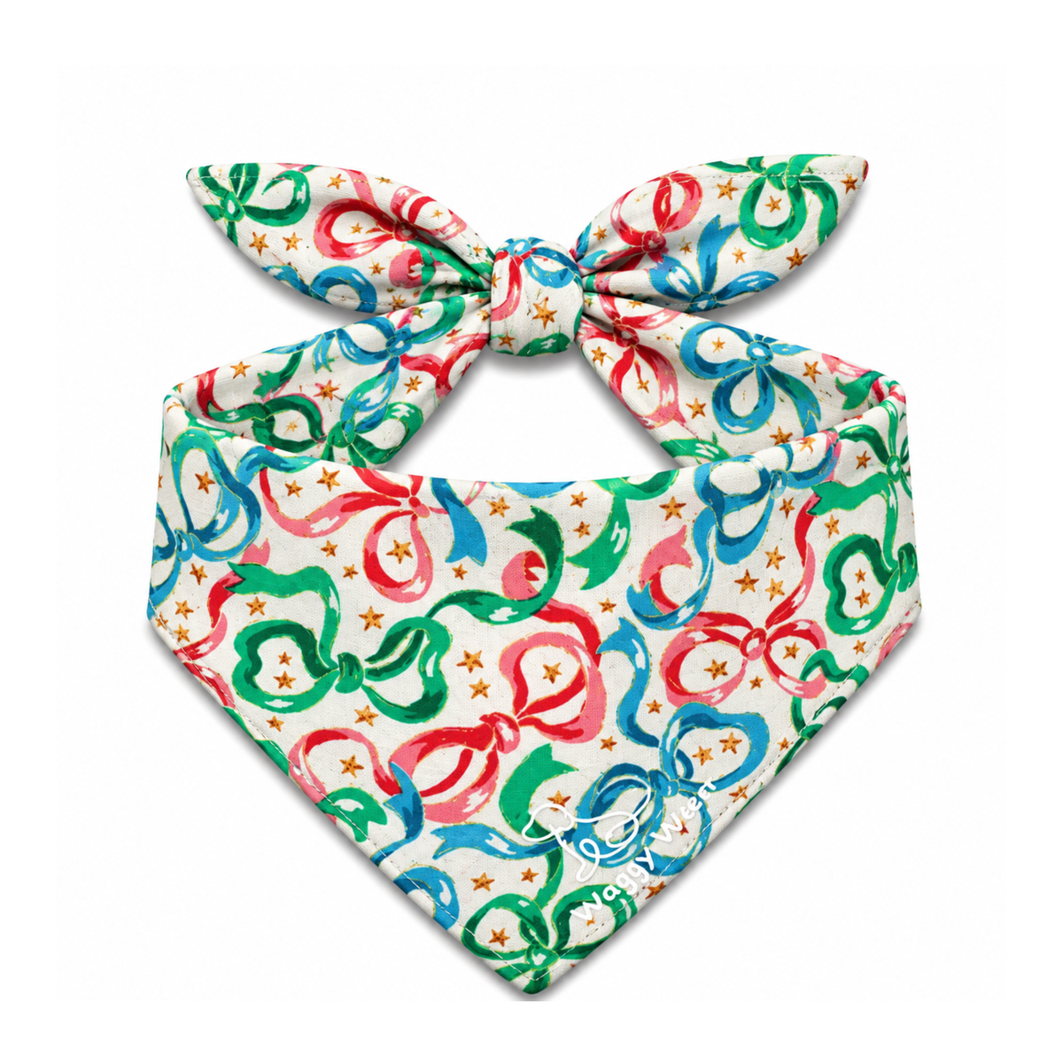 Tie-on dog bandana with red, green, and blue ribbon pattern on cream background.