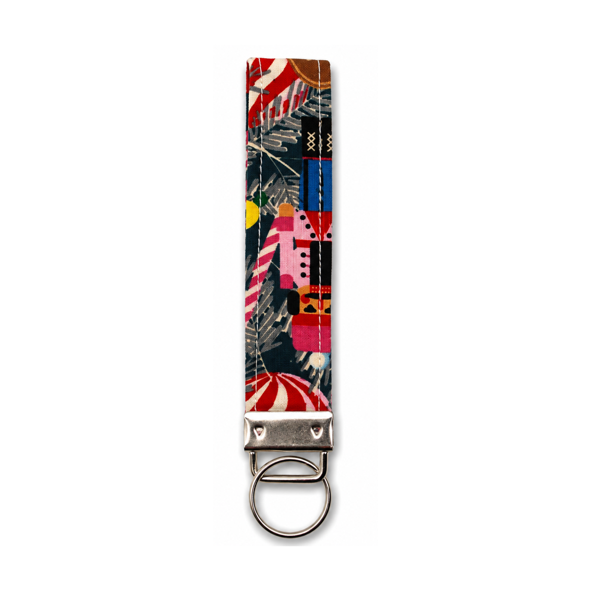 Colorful Christmas tree patterned fabric strap with metal keyring, featuring red, pink, and blue holiday motifs.