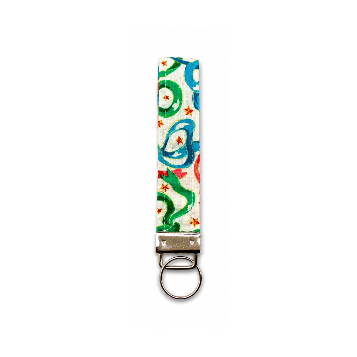 Ribbon Magic keychain with hand-painted green and blue swirls, orange stars, and a silver split ring.